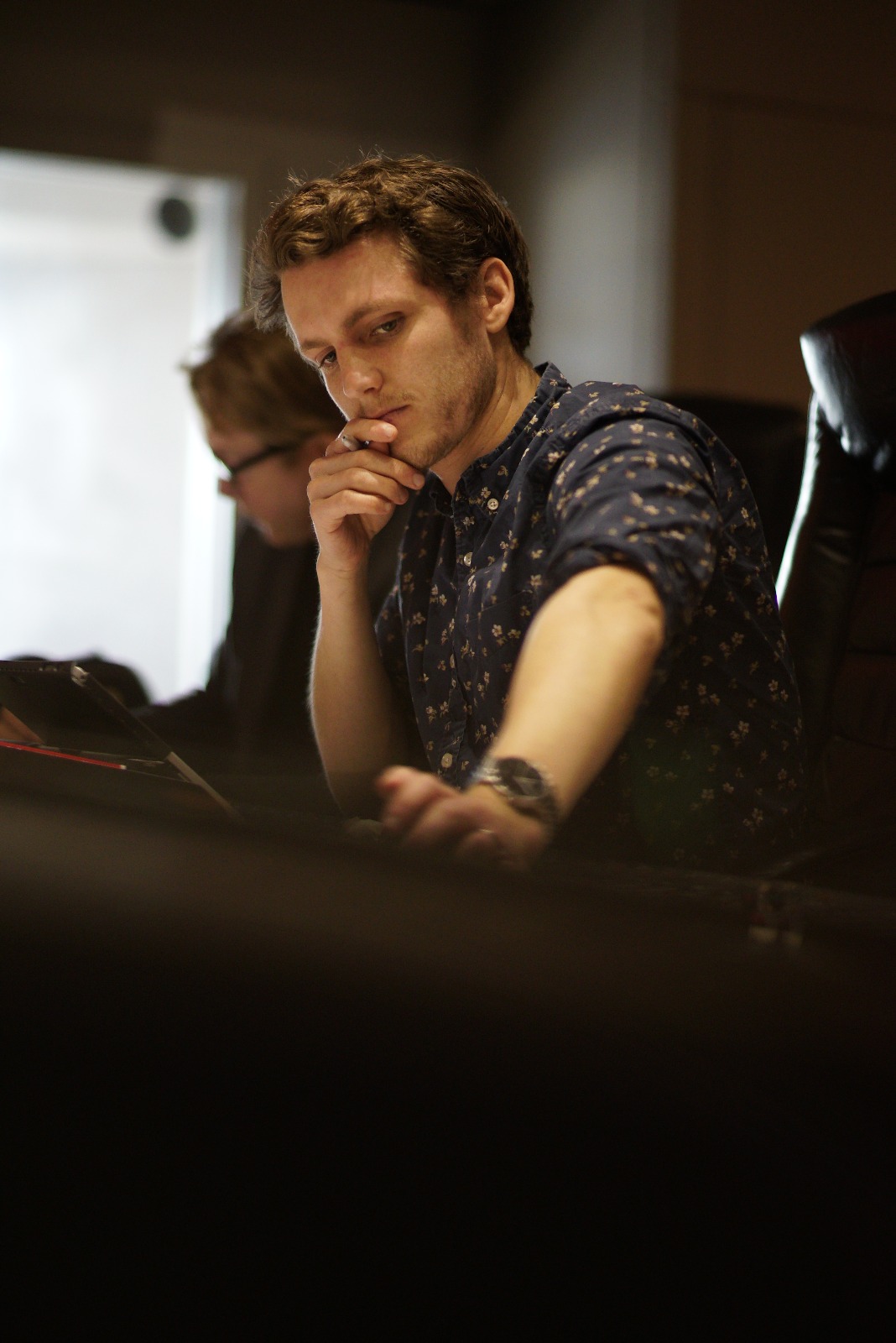 Jacob Moss at mixing console during recording session